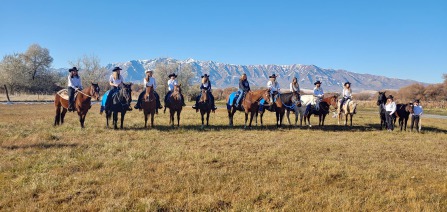 Group photo of girls with their horses